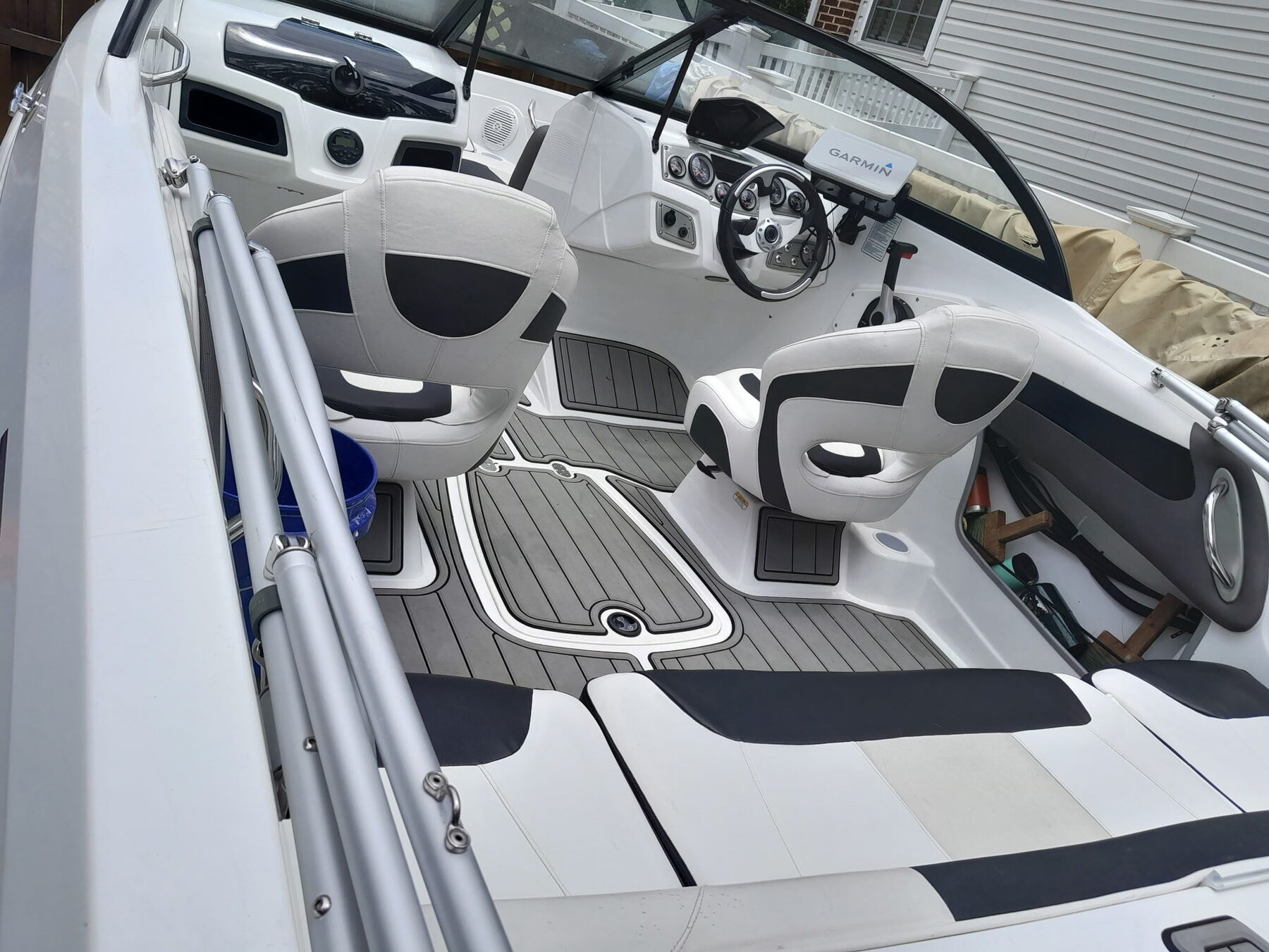 Runabout cockpit with reupholstered helm seats, bolsters and pads
