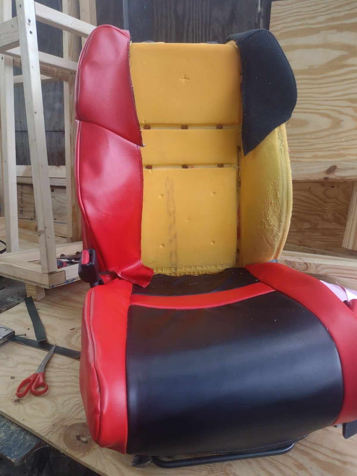 Sport seat re-cover in progress, new vinyl fitted over fresh foam